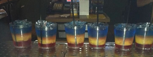 Red, yellow and blue drinks at the bar in the Village Inn of St. Ignace